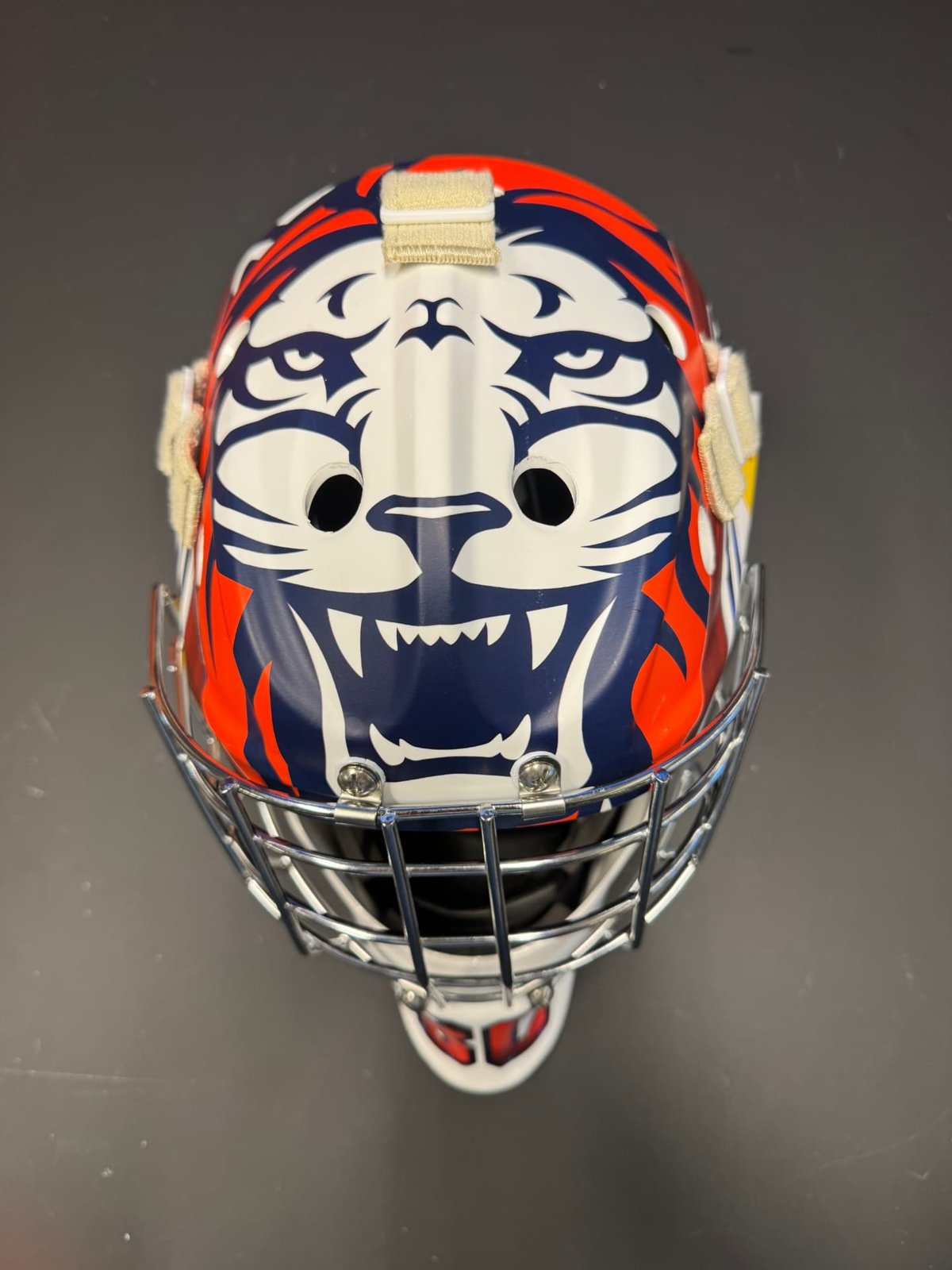 Målvaktsmask med tigeransikte i vitt, blått och orange